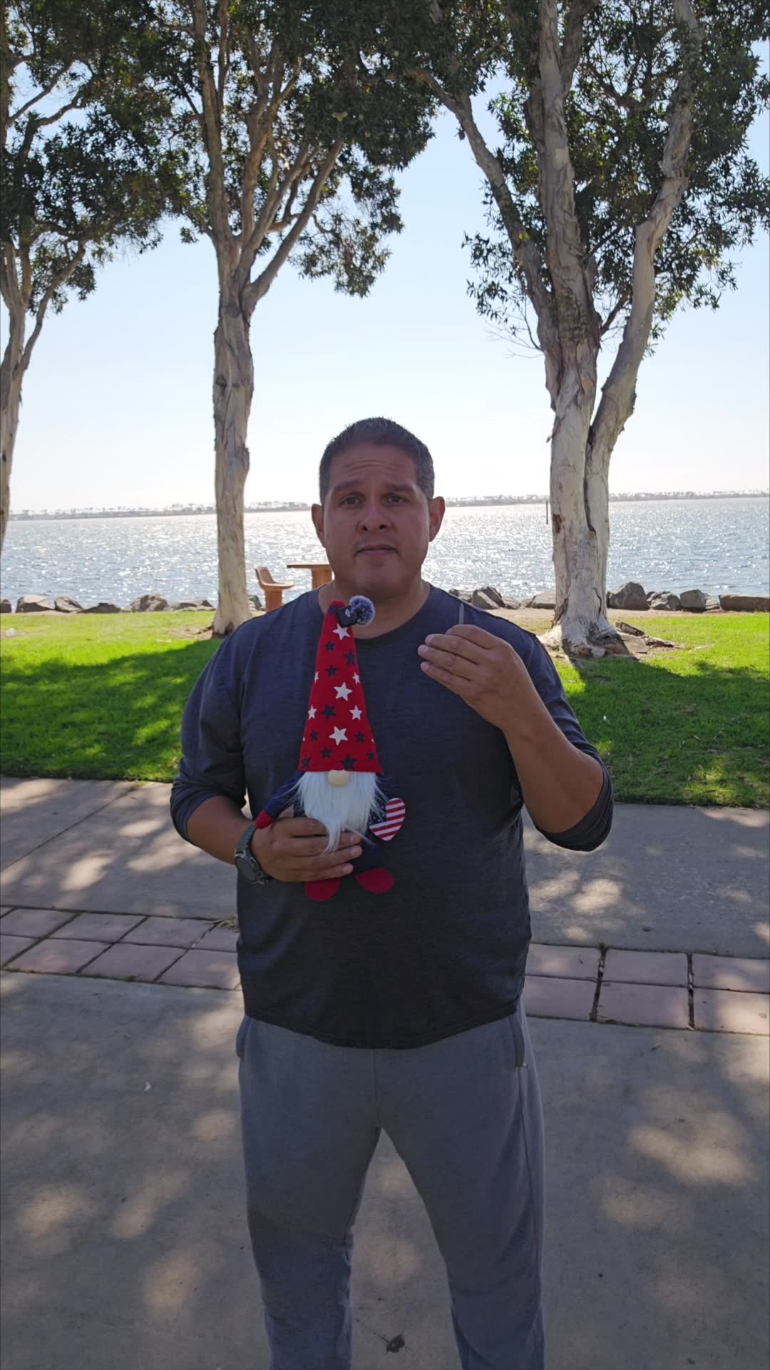 John on day 11 of the 90 day water fast at the bay, holding the gnome