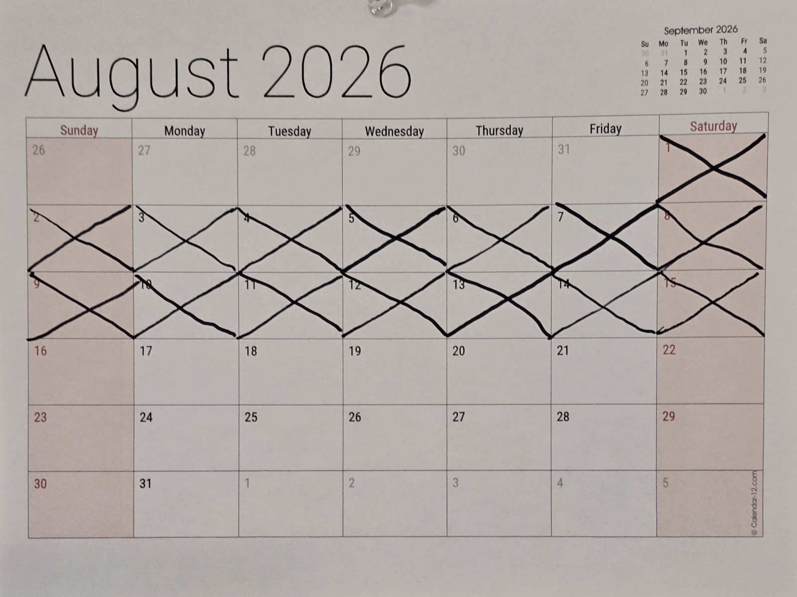 The wall calendar with fifteen days of August crossed off