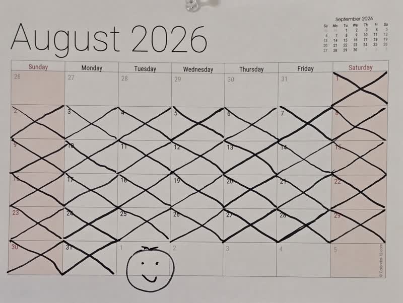The August calendar with all 31 days crossed off and a smiley face on September 1